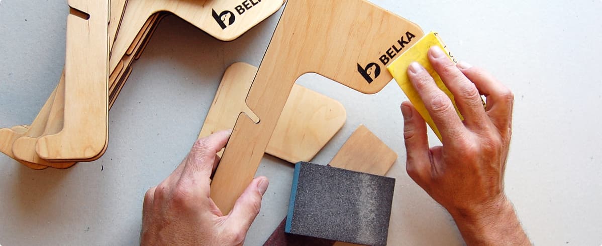 Hand sanding plywood laptop stands